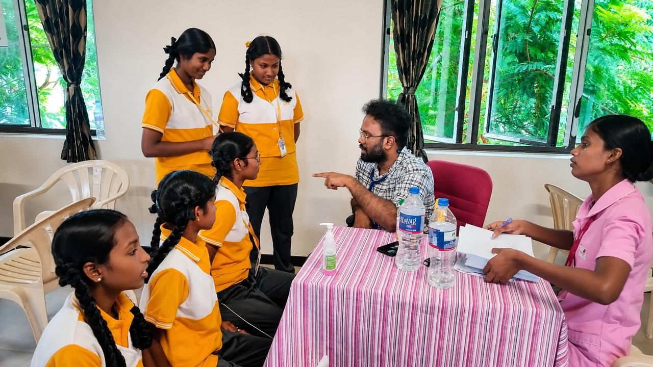 Dr. Mohanahariharan conducting a school health checkup for students in Pudukkottai